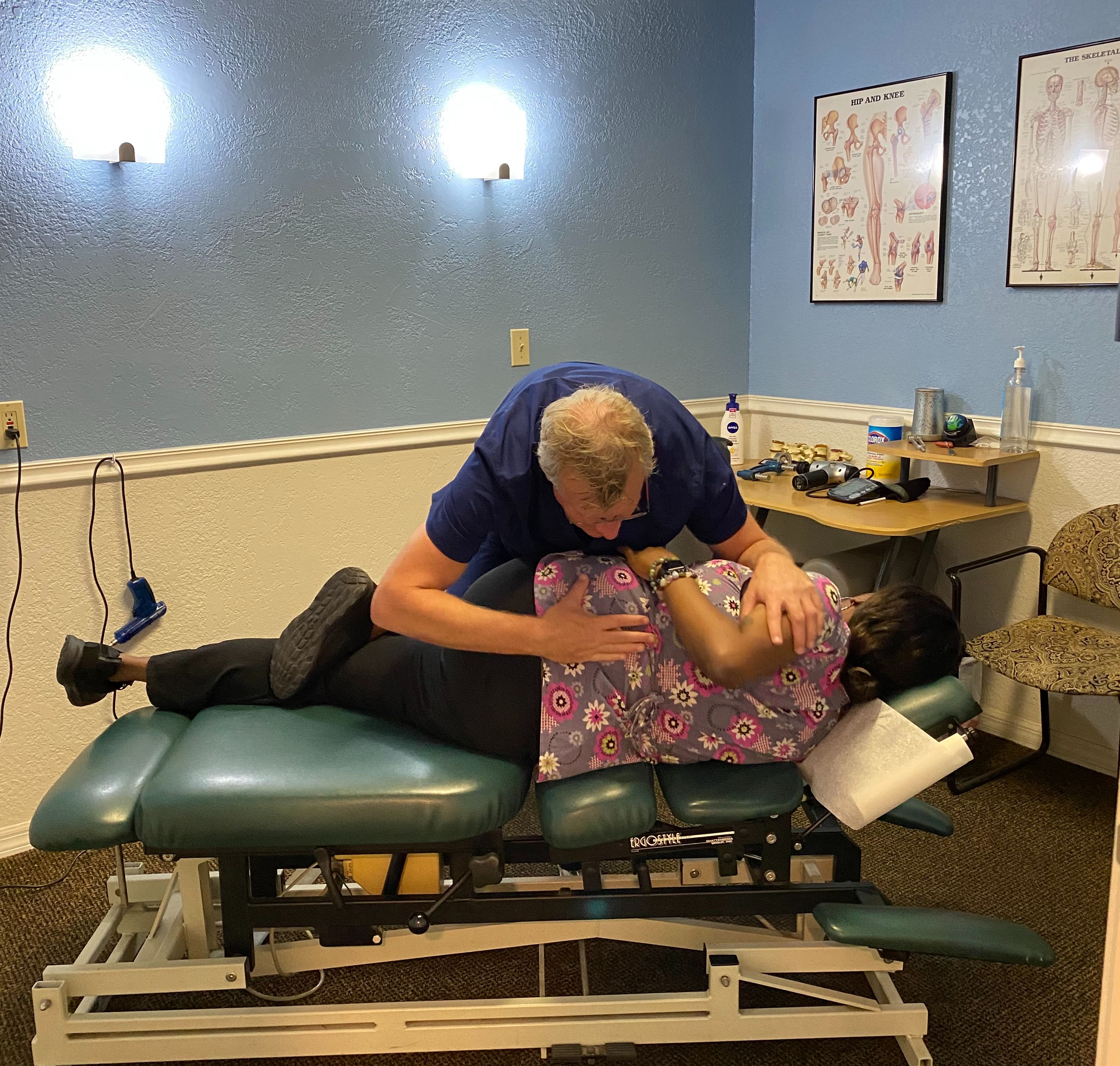 Dr. Cymanski adjusting a patient